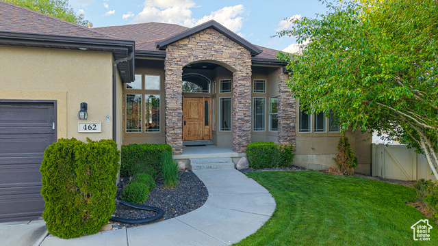 462 W ROSEMARY PL Saratoga Springs, Utah Tucked at the end of a quiet cul-de-sac in an established neighborhood, this home feels like a hidden retreat. Set on a third of an acre, the yard is a rare find-fully fenced with vinyl, lined with mature trees, and perfectly positioned to offer both privacy and mountain views. Whether you're tending the garden, shooting hoops on the backyard court, or hosting friends beneath the massive covered deck (complete with gas grill stub), this space invites living at its fullest. Inside, the home unfolds with clean lines, fresh paint, new carpet, and a sense of calm. Every listing you see claims immaculate condition, but this one truly is immaculate. The chef's kitchen anchors the main level with warmth and function, opening into airy gathering spaces and rich hardwood floors. Downstairs, a sprawling entertainment area offers room for every kind of connection. The master suite is grand in scale and feel, with details that elevate daily life, like a large jetted soaking tub, and dual shower heads. Craftsman finishes, wood-burning fireplace, extra-depth garage, and even an intercom system-all carefully maintained and move-in ready. Just 30 minutes from Salt Lake and 15 from Silicon Slopes, this is a home that balances convenience with quiet sophistication. The information found herein can be considered accurate, but any prospective buyer is encouraged to verify all information to their own satisfaction.