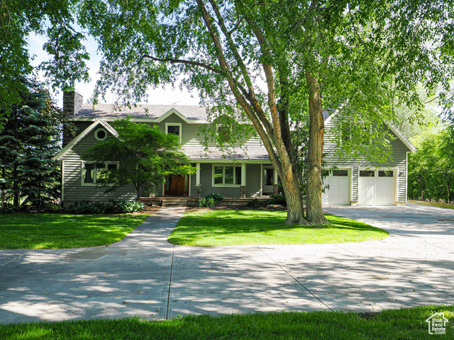 So many possibilities with this charming and unique property! Large 1.9 acre lot with a very nice home plus a 2,300 square foot barn and charming backyard pavilion. The home, barn and pavilion sit on 1.0 acre and the front area is it's own dedicated .9 acre parcel. The home was originally built in 1975 and then enlarged and remodeled by the current owners. The home is in very good condition and has four bedrooms, 3.5 bathrooms and room to grow in the full unfinished basement. The 48' X 48" barn is in like new condition with extra high 12 'and 14'  high garage doors.  Amazing opportunity for a new large estate or lovely as it is! Minutes to everything local, I-15, Silicon Slopes and SLC International Airport!