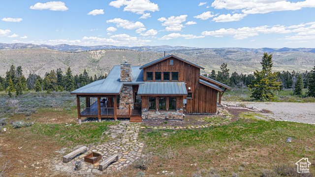 22677 E SNOWBIRD DR 47 Spanish Fork, Utah Be Sure to check out the tours! This beautiful home is the epitome of mountain living with this stunning Mountain Modern residence that effortlessly blends style and functionality. Nestled amidst breathtaking panoramic views, this home boasts an open-concept design with soaring 9" ceilings, creating a sense of expansiveness and light throughout. Step inside to discover meticulously crafted custom cabinetry and built-ins that enhance both aesthetics and storage. The gourmet kitchen is a chef's delight, featuring a spacious butler pantry complete with a sink, ensuring seamless entertaining and meal preparation. Warmth and comfort are prioritized with radiant boiler heat, supplemented by a brand-new boiler for efficiency and reliability. The expansive deck wraps gracefully around the back of the home, offering an unparalleled setting for relaxation and outdoor gatherings, all while soaking in the stunning vistas from every angle. Luxury flooring choices, including rich hardwood and polished concrete, complement the home's sleek design. For those with a passion for hobbies and storage, the detached workshop, equipped with a garage door, provides the perfect space for ATVs and toys. This property is a rare gem, offering a seamless blend of modern amenities and timeless charm in a truly spectacular mountain setting. Don't miss the opportunity to make this extraordinary home your own.