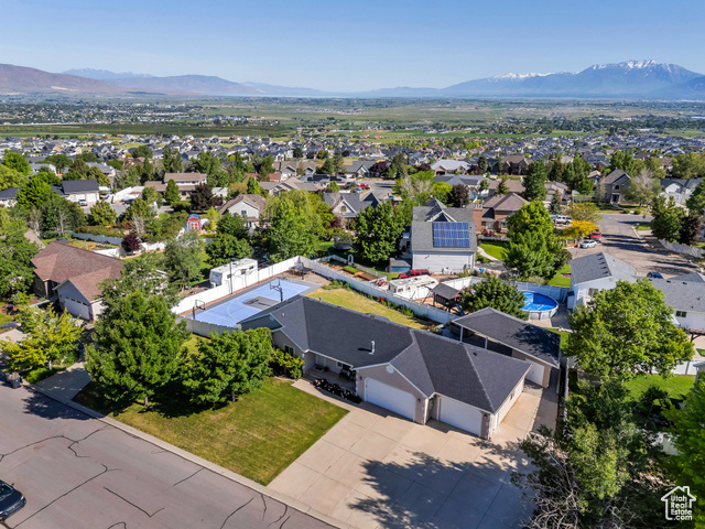 69 E HUDSON DR Elk Ridge, Utah Enjoy stunning mountain and valley views from this beautifully updated Elk Ridge home. Inside, you'll find an open concept floor plan with new carpet, refinished hardwood floors, updated kitchen cabinets, new kitchen appliances, a new furnace, freshly painted interior, and a new roof. With a 4-car garage, two RV pads, covered patio, large basketball court, and a hot tub, you will have plenty of space to entertain. The fully finished basement ADU with a separate entrance makes a great opportunity for potential income or to expand your own living space! Square footage figures are provided as a courtesy estimate. Buyer is advised to obtain an independent measurement.