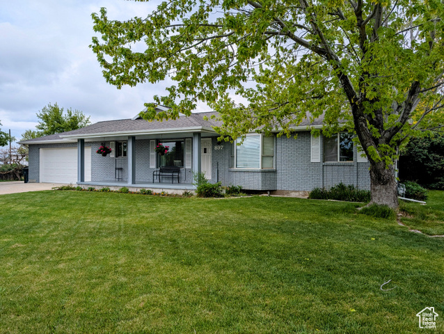 897 E 1200 N Mapleton, Utah Charming North East Mapleton all brick home with many upgrades and a spacious and private back yard retreat. This beautifully updated 6-bedroom, 3-bath home offers 3,168 square feet of comfortable living space with an open floor plan. Recent upgrades include a fully remodeled kitchen and bathrooms, as well as new carpet, laminate flooring and tile through out the house. The new tankless water heater, new water softener and whole house water filter as well as a new roof provides modern comfort and peace of mind. 2 x 6 wall construction, generous wall and ceiling insulation, with double and triple pane windows keep utility bills surprisingly low. The spacious kitchen features granite countertops, updated appliances, and ample cabinetry-perfect for family gatherings. Kids will enjoy playing in the fully fenced back yard as well as in the bonus loft above one of the bedrooms. Step outside to your private oasis and relax around the fire pit. Enjoy the mature shade trees, mature fruit trees and versatile garden area, all maintained with full automatic sprinklers and drip systems. The extra-wide (652 sq ft) heated and insulated garage has room for your vehicles as well lots of storage and workspace, and includes a large storage room in the rear and a 220v power outlet. Need extra parking? There's room for multiple large vehicles, including trailers, RV's, boats, or any toys you may have. The backyard shed can handle all your yard care equipment and provides extra storage. Want your kids to attend highly rated schools? Tired of driving kids to school? This home is a short half block walk to Hobble Creek Elementary, a 2 block walk to Mapleton Jr High, and an easy walk to the bus stop for Maple Grove Middle School and Maple Mountain High School. It's also just a 3 block walk or bike ride to the Mapleton Bike/Hike trail that goes from Hobble Creek Canyon to Spanish Fork Canyon. Come check out this comfortable, updated, efficient, and well built home in North East Mapleton! Square footage figures are provided as a courtesy estimate only and were obtained from county records.
