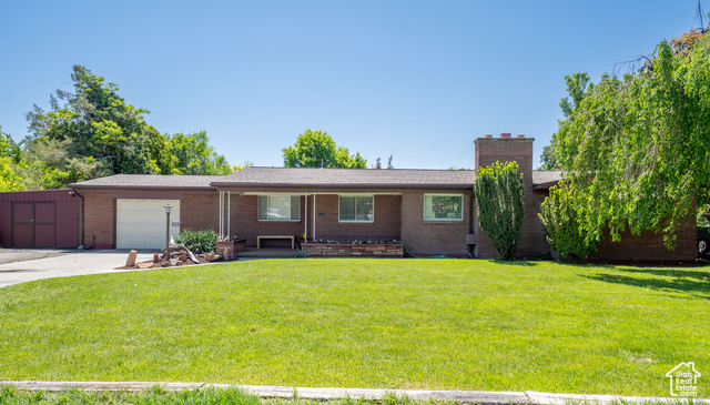 428 E 500 N Lehi, Utah This charming all-brick single-level home is located in a historic neighborhood in Lehi. It features a spacious yard and offers excellent indoor-outdoor living. The property is within walking distance of downtown Lehi, including schools, the library, shops, and restaurants. Additionally, it provides easy access to I-15 for convenient commuting. The home includes RV parking, a separate workshop, and a new roof installed in 2018. Buyers and buyer's agents to verify all information.