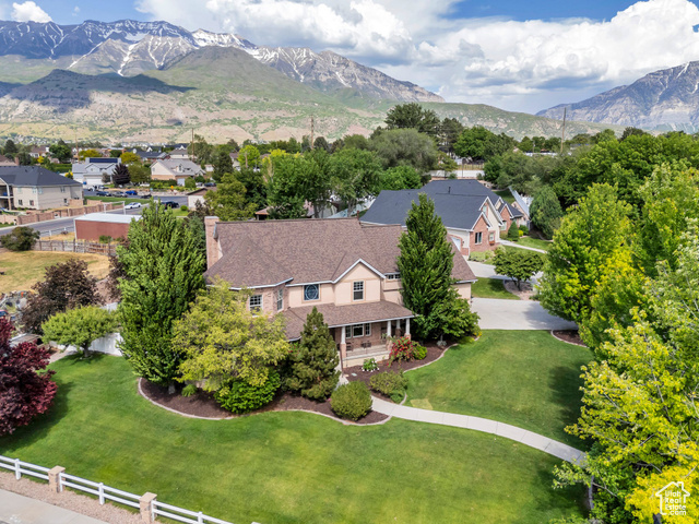 386 W 250 S Lindon, Utah LOCATION, UTILITY, BEAUTY!! Welcome to a stunning 4,961 sq ft single-family home offering 5 bedrooms, 4.5 bathrooms, and the perfect blend of timeless elegance and the natural beauty of Lindon, Utah. This home is a rare find-tucked into the foothills of Mount Timpanogos and nestled in a quiet, well-established neighborhood. First up, LOCATION. This home is just minutes from some of Utah County's best locally-owned dining experiences. You're just 5 minutes from local dining favorites like Vineyard Garden Thai, and La Costa Mexican Restaurant, where fresh, authentic flavors meet cozy, small-town vibes, and just 10 minutes from Orem's hidden gems like Asado Argentinian Grill. For entertainment, you're 12 minutes from SCERA Center for the Arts, 15 minutes from Provo Canyon's scenic trails and waterfalls, and just 5 minutes from Lindon Aquatics Center for summer fun. The location also offers quick and easy access to I-15 in less than 5 minutes, making commutes to Provo, Lehi, or Salt Lake City smooth and efficient. Now for UTILITY. Sitting on a generous 0.46-acre corner lot, this home is designed for practical living with plenty of space to stretch out and grow. The attached 3-car garage gives ample room for vehicles, gear, or a workshop; and the wrap-around porch is the perfect place to unwind in every season. The professionally landscaped yard is complemented by a sturdy 2-floor shed in the backyard-ideal for storage and hobbies. Inside, the spacious floor plan makes daily living and entertaining a breeze, and with 5 bedrooms and 4.5 baths, there's room for everyone and then some. And now the BEAUTY. Lindon is one of Utah's best-kept residential secrets, known for its peaceful atmosphere, friendly community, and absolutely breathtaking surroundings. This home is tucked into the base of the Wasatch Mountains, offering panoramic views, crisp mountain air, and a feeling of serenity that's hard to find elsewhere. The home's architecture is striking yet inviting, with beautiful finishes and natural light pouring into every room. The professionally landscaped yard features mature trees, curated flower beds, and a lush lawn that brings year-round curb appeal. Whether you're watching the sun rise over the mountains or enjoying a backyard evening with loved ones, this home is a sanctuary in every sense. Square footage figures are provided as a courtesy estimate only and were obtained from county records. Buyer is advised to obtain an independent measurement.
