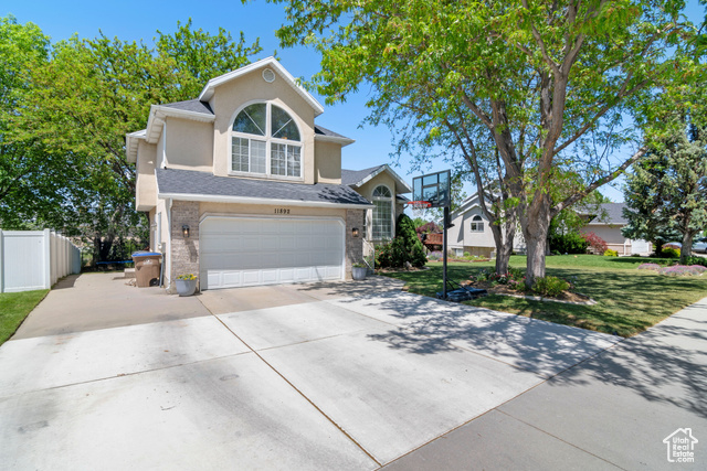 11892 S BLUE HERON DR Draper, Utah Welcome to this splendid 4-bedroom, 2-bathroom home nestled in the serene surroundings of Draper. Encompassing 1,895 square feet of stylish living space, this home sits on a generous 0.2-acre lot, providing ample outdoor space. An inviting entrance leads you to a meticulously designed interior boasting vaulted ceilings, enhancing the sense of space and light. The cozy living area is accentuated by a warm fireplace, inviting you to relax and unwind in its comforting ambiance. Each of the four bedrooms is generously proportioned, promising restful slumbers. Two well-appointed bathrooms cater to all family needs, offering both function and style. The home also features a 2-car garage, offering additional storage or workspace. With its thoughtful layout and design, this home provides a perfect setting for both entertaining and tranquil living. Located in the sought-after neighborhood of Draper, this home offers the perfect balance of city convenience and suburban tranquility. Don't miss this opportunity to own a piece of paradise in a prime location. Square footage figures are provided as a courtesy estimate only. Buyer is advised to obtain an independent measurement.
