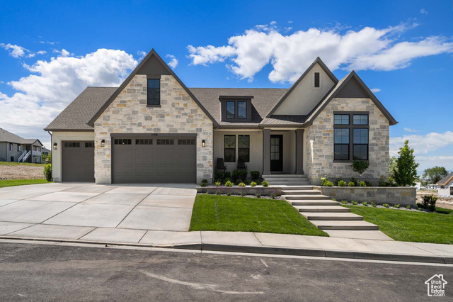 1098 E 110 S Pleasant Grove, Utah LOT#108. This stunning "Treble XL" nestled on the east bench against Mt. Timpanogos has awesome and timeless curb appeal with Symphony Homes' new "European Romantic" exterior, and tons of upgrades throughout this very popular and spacious floorplan! Quality LVP flooring, extra high ceilings and vaulted ceiling in the family room with stain grade beams. Kitchen has upgraded appliances, including 48" dual fuel gas range, built-in side by side fridge & freezer. Walk-in butler's pantry. Huge dining nook. Large laundry room includes ample cabinetry & countertop. Primary suite has a tray ceiling w/ crown and features a huge custom walk-in closet, and an elegant bathroom! Second bedroom on main level has a unique feature of a vaulted ceiling and its own en-suite bathroom! You'll love entertaining in the finished basement featuring a beautiful wet bar. Lots of storage space throughout including a dedicated finished storage room with shelving. Garage is finished, with epoxy flooring, and the 3rd stall is 43' deep (2-car tandem)! Large covered patio and additional patio with a large gas firepit to enjoy gorgeous views. Amazing craftsmanship and interior design throughout.