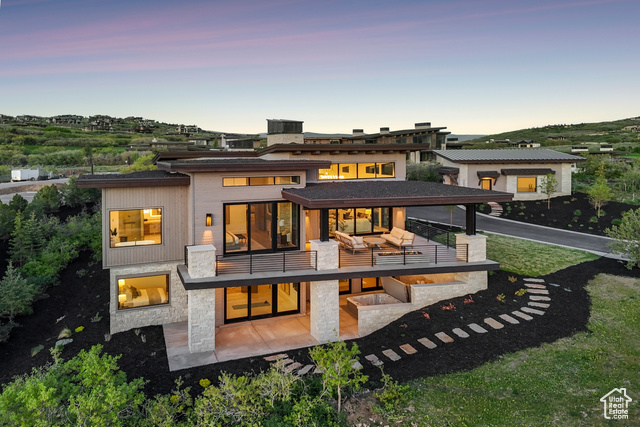 2058 E ADVENTURE CT 115 Kamas, Utah Premier Tuhaye Luxury Home in a class all its own, featuring majestic Deer Valley views. Perched on a quiet cul-de-sac in the highly sought-after Dancing Sun neighborhood of Tuhaye, this exceptional custom residence is a testament to craftsmanship, thoughtful architecture, and inspired mountain living. Impeccably finished and masterfully designed, every detail of this home speaks to timeless elegance and modern comfort. The ideal floor plan offers effortless main-level living, with a light-filled Primary Suite, glass-enclosed Office, gourmet Kitchen with Butler's Pantry, and an unforgettable Great Room. Floor-to-ceiling windows frame breathtaking mountain views, capturing sunset skies and the serenity of natural beauty. Two expansive, covered decks provide year-round outdoor living, inviting you to dine al fresco, unwind by the fire, or simply soak in the stunning panoramas. Downstairs, four additional en-suite bedrooms offer privacy and comfort for guests, while a spacious family/game room, climate-controlled wine room, and secluded hot tub retreat create the ultimate luxury experience. Set against a backdrop of mature trees and crisp mountain air, the lower-level patio extends an open invitation to relax in nature. Whether entertaining or enjoying quiet moments of solitude, this home offers a perfect balance of livability and refinement. Car enthusiasts, creatives, or adventure seekers will appreciate the unique garage configuration: an attached garage complemented by a separate oversized structure perfect for RVs, a golf simulator, workshop, or gear of any kind. A Full Talisker Club Membership is included, unlocking a suite of world-class amenities including golf, dining, spa, and exclusive mountain ski access at Empire Pass Tower Club. Custom designer furnishings are negotiable. This is more than a home, it's a sanctuary, a statement, and a rare opportunity to own one of Tuhaye's most distinguished properties.