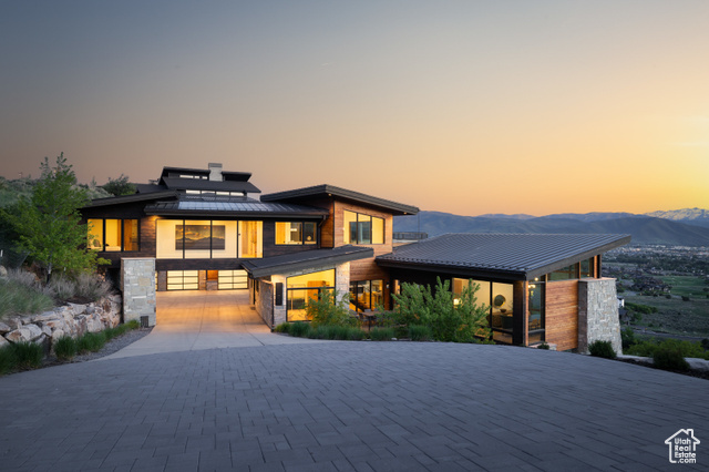 1373 EXPLORER PEAK DR N Heber City, Utah This remarkable mountain contemporary home stands out as one of Red Ledges' most striking and thoughtfully crafted residences. Built by luxury home builder Pure Haven Homes, it is located on a premier ridgeline, offering sweeping, uninterrupted views of the Heber Valley and the iconic silhouette of Mt. Timpanogos. From the moment you enter, you're greeted by stunning architecture, soaring ceilings, and walls of glass that capture the grandeur of the surrounding landscape. The open-concept layout is both elegant and functional, anchored by a chef's kitchen that features a full butler's pantry and a separate prep kitchen - ideal for seamless entertaining and everyday convenience. The primary suite is a true sanctuary, cantilevered to maximize views and wrapped in floor-to-ceiling windows. The spa-inspired bathroom is complemented by dual custom closets and a built-in laundry station - combining comfort with refined luxury. The lower level is designed for gathering and recreation, with a generous family room, game and media zones, and a custom bunk room perfectly suited for visiting family and friends. A Red Ledges Golf Membership is available with deposit, offering access to the community's award-winning lifestyle. Spanning nearly 2,000 acres, Red Ledges offers world-class amenities including the Jack Nicklaus Signature Golf Course, Jim McLean Golf School, Cliff Drysdale Tennis School, a resort-style pool and fitness club, and private equestrian facilities. Just 20 minutes from Park City and minutes from Deer Valley skiing, Red Ledges members also enjoy exclusive winter access to three private ski lounges at Deer Valley, accessed by our private shuttle services. This is a rare opportunity to own a home that combines architectural excellence, dramatic views, and one of the most complete amenity packages in the Wasatch Back.