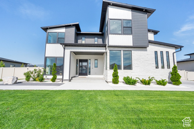 12272 S ELENA CV Herriman, Utah Exquisite 6-Bedroom Estate Offering Unrivaled Luxury and Sophistication Discover unparalleled elegance in this meticulously crafted 6-bedroom, 5 full-bath and 2 half bath estate, thoughtfully designed to accommodate grand-scale entertaining and refined living across three expansive levels. Soaring ceilings grace every floor-10 feet on the main, 9 feet on the upper and lower levels, with dramatic 12-foot ceilings enhancing the formal Dining Room, Family Room, Master Suite, and Spa-Inspired Master Bath. Immaculate luxury vinyl plank flooring flows throughout, complemented by spectacular floor-to-ceiling windows that bathe the home in natural light and showcase serene views. The gourmet chef's kitchen is equipped with premium Jenn Air appliances, including a 48-inch refrigerator and an impressive 6-inch thick countertop, seamlessly blending functionality with style. Entertain with ease in the fully appointed basement kitchen and enjoy effortless indoor-outdoor living through expansive sliding stackable glass doors opening to a private backyard retreat. Here, a fully equipped outdoor kitchen-featuring a grill, burners, refrigerator, and sink-awaits your gatherings, alongside a tranquil water fountain that creates a serene ambiance. Designed for both luxury and practicality, the residence offers two elegant family rooms, a dedicated theater room for cinematic experiences, a versatile game room, and a sophisticated office. The master suite features an expansive walk-in closet with direct access to a private laundry room, complemented by two additional laundry rooms on each floor for ultimate convenience. A walkout basement invites seamless transitions between indoor and outdoor living, while the three-car garage provides ample space for vehicles and storage. This estate represents the pinnacle of luxury living, where every detail is curated for comfort, elegance, and timeless appeal.