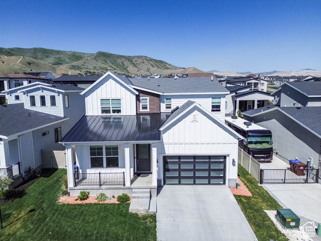 14908 S FAWLEY LN Herriman, Utah SELLER FINANCE AVAILABLE Don't miss this stunning home in Juniper Bend, a private gated community known for its breathtaking views and resort-style amenities. This spacious 4-bedroom, 3.5-bath residence features high-end upgrades throughout, including granite and quartz countertops in the kitchen, 11' ceilings, elegant 8' doors, and a thoughtfully designed floor plan. Enjoy seamless indoor-outdoor living with a covered patio that takes full advantage of the picturesque surroundings. The main level includes a convenient bedroom with an en-suite full bath-ideal for guests or main-level living. Juniper Bend offers exceptional amenities such as a clubhouse, pool, spa, and fitness center, and is just minutes from shopping, dining, scenic hiking and biking trails, and Blackridge Reservoir. A prime location paired with a beautifully upgraded home-don't miss this opportunity! All information is provided as a courtesy and should be independently verified by the buyer.