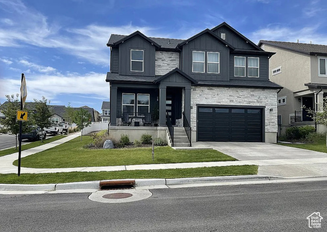 4201 W PALADIN WAY Herriman, Utah This fully upgraded home boasts modern updates throughout, blending style and functionality. Soaring ceilings add to the sense of grandeur, while the huge kitchen features soft close cabinets, island and quartz countertops and walk in pantry. The open living room includes high ceilings, floor to ceiling fireplace and large windows. The primary suite is a serene retreat accessible via french doors that includes a vaulted ceiling and ensuite bath featuring barn door, tub, and walk in shower and spacious closet. Additional conveniences include a sink in the laundry room and tankless water heater. The home also offers the potential for expansion with an unfinished basement. Conveniently located near schools, multiple parks and shopping centers.