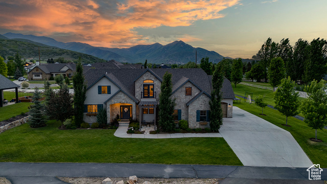 500 W CASCADE PKWY Midway, Utah Beautiful Home in Cascades at Soldier Hollow. This picturesque home features European architecture with stone & stucco exterior, wooden shutters and window planter boxes with Midways stunning mountain backdrop. Luxurious finishes throughout with white oak flooring, custom tile work and tasteful woodwork. Open floorplan with large picture windows. Spacious kitchen/dining area to accommodate large dining table, ceiling height cabinetry, & walk in pantry. Main level Primary Suite with dual vanities, soaker tub and walk in shower. Upper level offers great flex space with large loft, 3 bedrooms, a full bathroom and features an office nook with built in desk and balcony with direct views of Mount Timpanogos! Retreat to the fully finished basement, large rec room with wet bar, media space, 2 bedrooms and a full bathroom. Fully finished 3 car garage. Large yard and covered patio with stunning mountain views! Enjoy walking paths winding throughout the neighborhood as well as easy access to hiking/biking trails adjoining the development. Soldier Hollow is just up the road offering year round recreation with a golf course, bike trails, cross country skiing, sled hill and restaurant. Midway town center is just minutes away offering many amenities. Buyer to verify all.