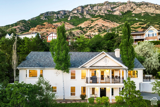 Stunning Provo home in desirable Oak Hill neighborhood. Breathtaking valley and mountain views, steps from hiking trails and minutes from BYU! This 4-bed, 5-bath gem features an open floorpan with vaulted great room and kitchen flowing seamlessly onto two decks, ideal for soaking in the magnificent scenery. The kitchen offers a gas stove, large dining area, and dumbwaiter to conveniently carry groceries from the garage to the kitchen. Retreat to the large primary bedroom with walk-in closet and ensuite bath. Step out to a private patio, perfect for relaxing on a warm summer night. Down the stairs, you will find a spacious, walk-out basement with mother-in-law apartment-perfect for rental income or multi-generational living. Enjoy two family rooms in the basement, with amazing views from the above ground windows, a den with large walk-in closet, and a 2-car, heated garage, with ample storage and plenty of driveway parking. This home has many updates, including new flooring, carpet, paint, newer appliances in basement apartment, and new garage door motor. Sellers added a $3700 water filtration system throughout home. Call today for a private showing!
