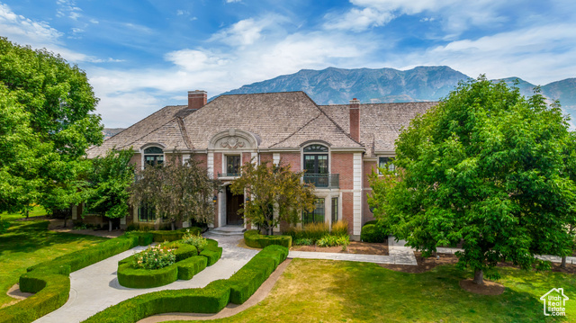 Nestled in the exclusive, gated, Vintage on The River community in Provo, this magnificent 2-story, west-facing, 17,000 sq ft estate offers luxury living at its finest. Tucked away on a quiet cul-de-sac and spread across 1.15 acres, this home is a perfect blend of comfort and style. The expansive kitchen is a true centerpiece of the home, featuring custom cabinetry, a coffered ceiling, and an adjacent semi-formal dining area with a cozy fireplace and patio access. A formal dining room off the kitchen creates the perfect setting for hosting gatherings. The Primary Suite serves as a true retreat, featuring a private walkout to the backyard, a sunroom with serene views of the surrounding greenery, two oversized walk-in closets, a jetted bathtub, an oversized shower, and a bidet. For added convenience, the main-level Mother-In-Law or accessory apartment includes access to the adjacent laundry room, an en-suite kitchenette, and direct access to the backyard, offering privacy for guests or extended family. The stunning Great Room features floor-to-ceiling windows that overlook the backyard, filling the home with an abundance of natural light and providing a seamless connection to the outdoors. The main level also features a dedicated home office, equipped with custom cabinetry and shelving, with doors leading to the back patio. Upstairs, each bedroom is paired with its own en-suite bathroom, featuring separate tubs and showers. An oversized Family Room with a vaulted ceiling, kitchenette, and a walkout balcony to an expansive deck offers an ideal space for entertaining. With an unfinished basement, there's ample opportunity to customize and expand your living space to suit your needs. The expansive backyard patio spans the entire backside of the home, perfect for outdoor gatherings and relaxation. Adjacent to the property, the 16-acre Riverview Park offers playgrounds, tennis and pickleball courts, and extensive green space for recreation. Just minutes from State Street, you'll enjoy easy access to a variety of dining, shopping, and entertainment options. This estate is one that you won't want to miss out on - reach out to schedule a private tour today! Buyer's/Buyer's Agent to verify all.