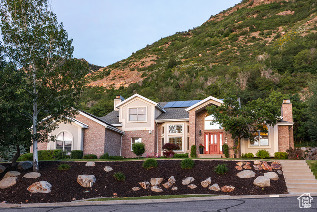 11939 S HIDDEN CANYON LN Sandy, Utah Tucked away in a quiet cul-de-sac and bordered by the Wasatch Forest Service and Bonneville Shoreline Trail, this stunning contemporary home offers a distinctly modern and comfortable feel. With 6 beds, 5 baths, and more than 6,000 square feet of thoughtfully designed living space, this is a home that will see you through every season of life. Built in 1993, the property features soaring vaulted ceilings in the great room, skylights in the family room, and seamless indoor-outdoor living (more on that in just a minute). The updated chef's kitchen is a showstopper-equipped with premium Wolf appliances, a large island, and hood venting to the outside, things flow seamlessly into the dining and family rooms, creating the perfect space for everything from catered parties to formal dinners and late-night, fireside chats. From here, a wall of expansive windows frames the beautiful hills just behind the home and leads to the first of two decks out back, this one with plenty of room to dine, lounge, and BBQ (the second has an in-ground jacuzzi for nights with a glass of bubbles among the bubbles...sold yet?). Rooms throughout the property are ample and spacious. Closets in the main and second floor bedrooms are all customized, with three of them being walk-in closets. A massive basement lends the perfect area for movie and game nights by the downstairs fireplace. Step outside and you'll find easy access to scenic trails that lead to the iconic Bear Canyon Suspension Bridge-perfect for a morning hike or an evening stroll. Additional highlights here include a heated driveway, 3-car garage, solar panels, and unparalleled proximity to world-class outdoor recreation. Located just 10 minutes from the mouth of Little Cottonwood Canyon, this home offers quick access to skiing, hiking, and biking. All told, a rare blend of space, luxury, and location-this one just might be your gateway to mountain living with modern convenience.
