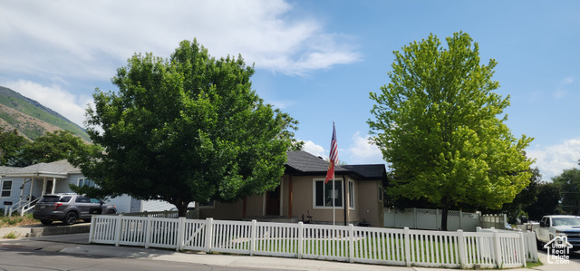 There is great potential opportunity for an ADU or even a Duplex with this lovely, fully fenced, corner lot property! This is a 4 bedroom, 2 full bathroom home with a separate basement entrance that used to be a Duplex, but was converted into a single family home. The interior and exterior has been almost completely updated with new paint, flooring, newer stainless steel appliances, travertine countertop, backsplash, and flooring in kitchen, and LVP in the living room. There are still a few finishing touches that need to be finished, so if you are willing to do a little bit of work yourself, this house will be 100% updated. Furnace and water heater are less than 10 years old, and there is a large shed out back which could be used for a variety of things including storage or a workshop. The home is also wired for a Fire Alarm System and a Security System.