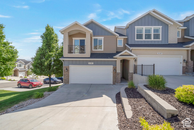 Live and vacation in the same place with this immaculate end-unit.  2 HOA clubhouses boasting waterpark features and a large event center opulent enough for weddings.   Feeds to the best schools in Utah including the best charter elementary school - Ignite.  4 bed, 3.5 bath end-unit townhome is amazing in every way-clean, modern, stylish.  The open main floor boasts upgraded woodgrain tile, granite countertops, and a cozy fireplace in the main living area.  Upstairs, the massive primary suite includes a private deck and a stunning ensuite bath. The finished walk-out basement with separate access adds flexible living space, and leads to a fenced private yard-perfect for pets, kids, or relaxing outdoors.  Neutral colors throughout, Upgraded flooring in all bathrooms, Plenty of space and natural light, Turnkey condition.