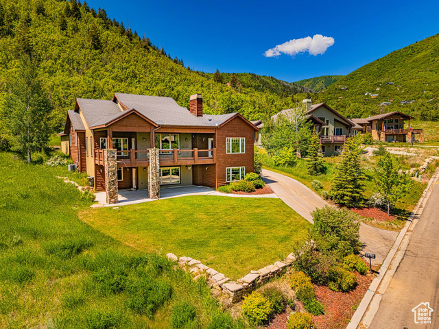 1273 W LIME CANYON WAY Midway, Utah Discover luxury living on Midway's bench, where sweeping mountain vistas and refined design come together on a private 0.6-acre hillside that backs to open space-free from HOA restrictions. Direct trail access lets you step from your yard onto miles of paths for hiking or biking-and return home in time for coffee on the deck as the canyon fills with morning light. The main level features vaulted ceilings, a chef's kitchen outfitted with granite counters, premium appliances, and an oversized island-ideal for hosting friends or enjoying a quiet start to your day. An expansive deck frames panoramic views of Pine Canyon and extends your living area outdoors for barbecues or evening gatherings under the stars. Four en-suite bedrooms and five full baths provide private retreats for every household member. An expansive great room with wall-to-wall windows, a generous family room, and a large bonus room deliver flexible spaces for entertaining, work, or relaxation. A custom mud and laundry room keeps gear organized, while the oversized three-car garage and lower-level walk-out simplify gear storage and everyday flow. Just minutes from Midway's downtown, you'll find boutique shops, farm-fresh dining, and specialty cafs. Deer Creek and Jordanelle Reservoirs are within easy reach for boating, paddleboarding, or fishing when water recreation calls. 1273 W. Lime Canyon Way combines sophisticated finishes, seamless indoor-outdoor transitions, and a premier location-without the constraints of an HOA-to create a mountain retreat that appeals to discerning buyers.
