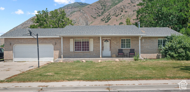 1669 E 300 S Springville, Utah Charming Brick Rambler in Quiet Neighborhood Fixer-Upper Opportunity! Welcome to this charming brick rambler, nestled in a peaceful neighborhood just behind Springville Jr. High. Featuring a classic front porch perfect for relaxing in the morning or greeting neighbors, this home exudes potential and character. Inside, you'll find a spacious layout ready for your personal touch and updates. With a little TLC, this property is an excellent opportunity to build equity and transform it into your dream home. The spacious backyard offers privacy and a direct view of the lush grounds of Springville Jr. High, and mountains of the Wasatch front, providing breathtaking views and a sense of openness and greenery. Enjoy the quiet, well-maintained community, with convenient access to local amenities, schools, and parks. Don't miss out on this fantastic chance to create the perfect home in an ideal location!