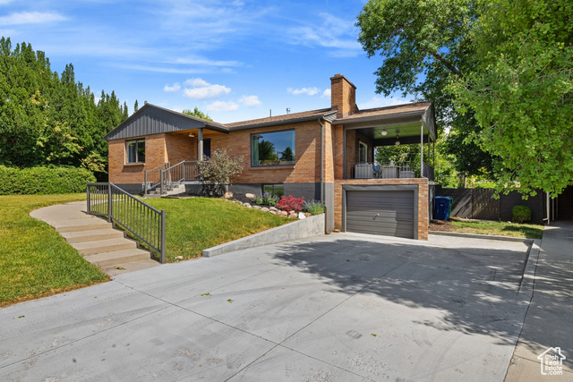1876 E NORTHWOODSIDE DR S Holladay, Utah A modern designer retreat in the heart of Holladay-crafted for today's lifestyle and ready to move right in. Thoughtfully updated throughout, this home blends clean lines, warm finishes, and flexible spaces that grow with you. Wide-plank white oak floors and natural light set an elevated, welcoming tone the moment you enter. The stunning kitchen anchors the home with navy cabinetry, quartz countertops, floating walnut shelves, and a large bar-height island-perfect for casual meals, hosting friends, or wine after work. A covered patio just off the kitchen expands your living space outdoors, with a second patio ideal for grilling and relaxing. The layout is smart and adaptable: a private owner's wing with a large built-in closet and a sophisticated main bath with a floating walnut vanity and timeless, modern finishes, plus a second main-level bedroom for a nursery or home office. Downstairs, two spacious bedrooms and a bright, open flex space provide room for a playroom, gym, or media lounge. Function meets comfort with a beautifully finished laundry room (washer/dryer included), ample storage, and a clean, organized entry area. The attached garage includes a 240V EV-ready hookup, and a side yard offers extra space for a trailer or gear-all without compromising curb appeal. Perfectly positioned near the best of everything: minutes to Sugar House, Holladay, and Millcreek town centers, close to top-rated schools, parks, and freeway access, and tucked in a neighborhood that feels peaceful but connected. Showings available now-come experience the difference in person.