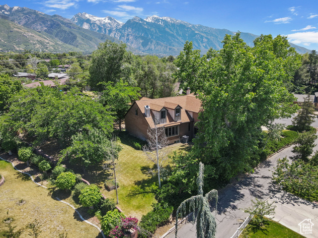 2673 E TONI CIR S Cottonwood Heights, Utah OPEN HOUSE: Saturday June 14th from 1pm to 3pm. Welcome to your next home in the heart of Cottonwood Heights! Tucked away on a quiet cul-de-sac, this expansive 4,721 sq ft home sits on a private 0.40-acre lot and offers the perfect blend of space, versatility, and comfort. With 6 bedrooms, 3.25 bathrooms, 2 kitchens, and 3 distinct living rooms, the layout is ideal for multi-generational living, entertaining, or simply spreading out in style. Step inside the grand entry foyer, where the scale and flow of the home will immediately impress. The main level features a spacious living room with city views with a cozy fireplace, a formal dining room. Enjoy a well appointed kitchen with semi-formal dining space and a breakfast bar, perfect for everyday meals or special gatherings. You'll also find a 3/4 bathroom, a laundry room, and an additional family room with fireplace. Upstairs, has 4 generously sized bedrooms and 2.5 bathrooms, offering ample space for family/guests. The fully finished basement includes a second kitchen, living room, and two additional bedrooms. Plus a private side entrance, creating a perfect setup for a future Internal Accessory Dwelling Unit (ADU) with rental income, or comfortable mother-in-law family/guest quarters. Enjoy peace of mind with major updates already completed: New air conditioner and water heater, both replaced in 2024. All appliances included, Main Living Room TV included, Hot Tub included! Located in a prime east bench neighborhood just steps from the Cottonwood Heights Recreation Center, and minutes from Willow Creek Country Club and the world-class outdoor recreation of Big and Little Cottonwood Canyons. Rarely does a home of this size and potential come available in such a sought-after location, don't miss your chance! Square footage figures were obtained from county records. Buyer and Buyers Agent to verify all.