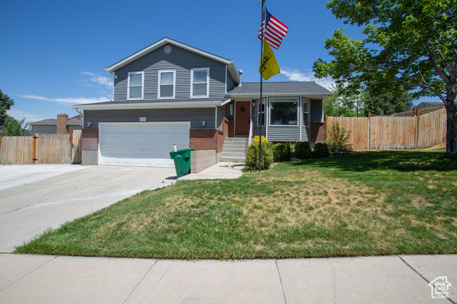1211 E SPRING RIDGE DR S Sandy, Utah Corner lot in East Sandy! Newer furnace and AC! 2 tone paint throughout. Family room has vaulted ceiling and large bay window. Open kitchen with upgraded cabinets and drawers. Stainless fridge stays. Large family room with doors opening to back patio. Wood burning fireplace. Big master suite with 3/4 bath. Laundry room has great space for storage. Fully fenced back yard with storage shed. Come on over and check it out!