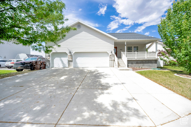 2017 E LODGE POLE DR Eagle Mountain, Utah Spacious and beautifully updated 5-bedroom, 2-bath rambler in the desirable Mountain View neighborhood of Eagle Mountain! With 3,300 sq ft of living space, this home offers comfort and flexibility for every lifestyle. The main level features an open floor plan with vaulted ceilings, a large great room, a formal living room, and updated kitchen with French doors leading to a deck-perfect for entertaining. The kitchen also includes a convenient portable island. The primary suite has a walk-in closet and separate tub/shower. The basement is 50% finished with two bedrooms, and space to customize. Enjoy central air, gas heat, and thoughtful upgrades throughout. Situated on a fully fenced 0.19-acre lot with mature trees, a front porch, and a 3-car attached garage. No HOA! Conveniently located near schools, parks, and shopping. Refrigerator, range, microwave, blinds, and portable kitchen island are included. Schedule your private showing today! Square footage figures are provided as courtesy estimates only and were obtained from county records.