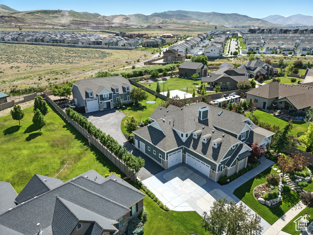 14956 S CASTLE VALLEY DR W Bluffdale, Utah There is too much apart of this home to fit into here! This Timeless Modern Craftsman estate, updated to 2025 design standards, is a must-see masterpiece! This home has nearly 10,000 sq ft of living space, it seamlessly blends craftsman charm with contemporary luxury. Featuring a main-level primary suite, 2 custom ADUs, a full gym, home theater, and a detached garage with a full-size basketball court, this home truly has it all. An updated gourmet kitchen, new bosch appliances, modern lighting, and energy-efficient features make it both beautiful and practical. Plus, there's plenty of space for your biggest RV, toys, or future plans. Don't miss the chance to own this incredible home in Falls at Boulden Ridge!