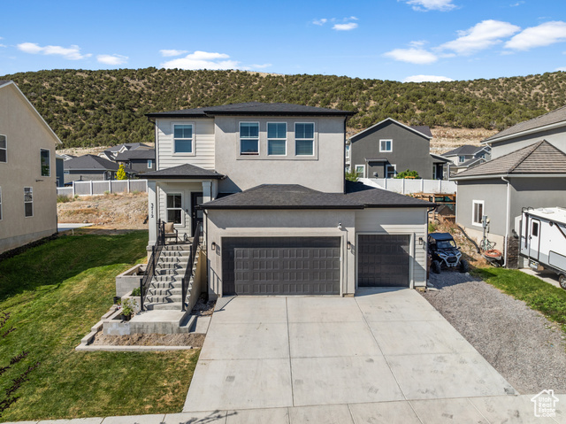 3712 E LONG RIDGE DR 124 Eagle Mountain, Utah Contemporary jewel, nestled in the foothills of the Kiowa Valley with amazing lake and mountain views. Perfect for those who enjoy an active lifestyle. Located near hiking trails in the subdivision. Close to the Eagle Mountain Mountain Bike Preserve. Gorgeous Laminate wood floors. Tile bathroom floors. Quartz and granite countertops. Perhaps the views of the interior finish details and the architecture of this residence rival its setting. And, there is no HOA here.