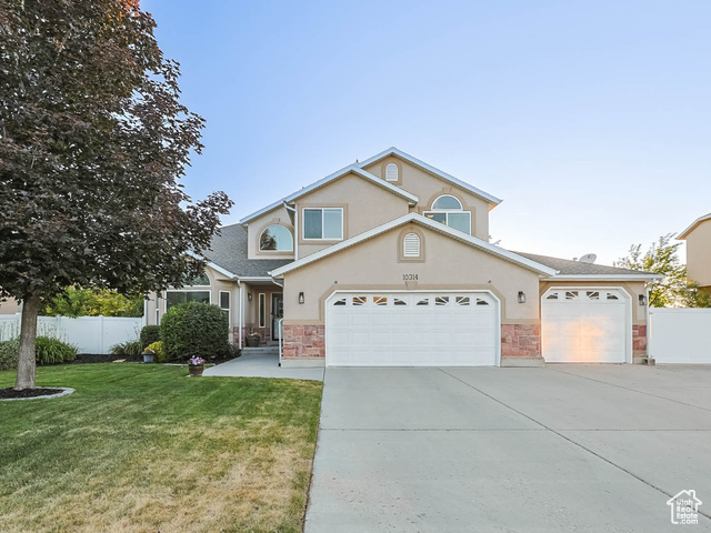 10314 S 3970 W South Jordan, Utah 6-bedroom, 4-bathroom home located in the heart of South Jordan. Freshly painted throughout, this home features a grand, expansive entryway with soaring vaulted ceilings that create a bright and welcoming atmosphere. Enjoy the generously sized primary bedroom and en-suite bathroom. Step outside to a large backyard with a spacious covered awning and large patio. The yard also features RV that can easily fit a 38 foot RV behind the gate with an electrical hookup. Ideally located less than 5 minutes from Costco, shopping, gyms, and Bangerter Highway, you'll love the unbeatable accessibility without sacrificing peace and privacy. Open house Saturday June 14th 11-1 Don't miss this incredible opportunity to own a move-in-ready home in one of South Jordan's most convenient neighborhoods!