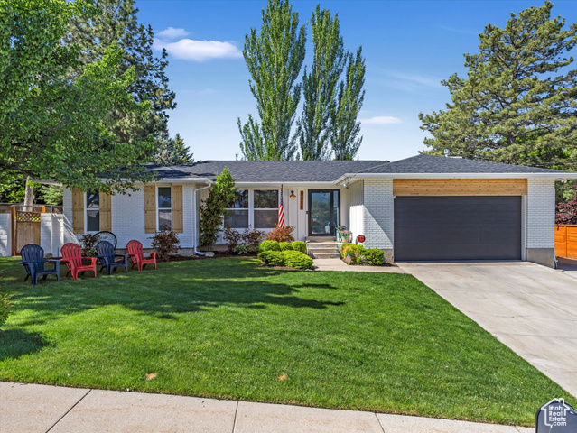 9714 S BUTTONWOOD DR E Sandy, Utah Experience unmatched elegance and modern mountain living at 9714 S Buttonwood Dr in Sandy, UT-a fully reimagined home perched on the east bench with breathtaking views of Mount Olympus and the entire Salt Lake Valley. This 5-bedroom, 3-bathroom sanctuary features a $295,000 high-end remodel by Simply Sam Design, showcasing luxury finishes, smart-home upgrades, and jaw-dropping design elements throughout. From the moment you step inside, you'll be captivated by the open-concept layout, stunning steel and wood-accented beams, a custom steel staircase, and Philips Hue smart lighting that sets the perfect ambiance. The chef's kitchen is an entertainer's dream, complete with a slate-topped island, granite counters, caf-series appliances, a pot filler, and accordion doors that fully open to a covered patio-ideal for seamless indoor-outdoor living. Outside, enjoy summer evenings under programmable JellyFish lighting, unwind in the Bullfrog hot tub, or take in the professionally refreshed landscaping and cedar accents. The new roof (2024) with a 40-year transferable warranty, insulated garage with custom workbench and shelving, 30-ft RV parking with 20-amp hookup, and smart LiftMaster garage opener offer both beauty and utility. Zoned to top-rated schools and located in a great Sandy neighborhood, this home balances timeless design with forward-thinking features. Don't miss your chance to own a true masterpiece-schedule your private tour today!