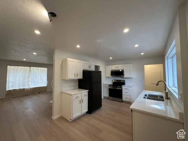 9993 S BARIUM LN Sandy, Utah ***You have found it!!*** This adorable 4 bed, 2 bath Sandy retreat is your ticket to homeownership under $525K! and the sellers are offering a $10,000 concession for a rate buydown, closing costs, or whatever you need! With a new kitchen, roof, and updated windows, all the heavy lifting's been done. Park your RV stress-free and move right in-because why keep throwing money away on rent when you can own? Covered parking, a nice handymans shed and mature trees covering the backyard and back patio make this home ready for you Google fiber is installed in the house and ready to go! Schedule a tour today!! Square footage figures are provided as a courtesy estimate only and were obtained from estimate. Buyer is advised to obtain an independent measurement.