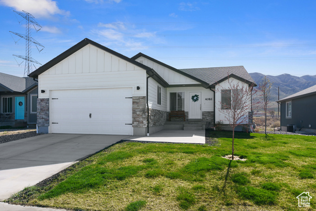 4082 N POPLAR DR Eagle Mountain, Utah Welcome to your dream home nestled in a beautiful country setting at the base of scenic Lake Mountain! This newer, charming home offers breathtaking views and backs up to expansive non-buildable open space-ensuring peace, privacy, and unbeatable scenery. Fully landscaped and fenced, the yard is ready for outdoor fun and relaxation. Inside, enjoy modern comforts like a tankless water heater and an energy-efficient design with an Energy Star rating. The unfinished basement is a blank canvas-perfect for adding extra bedrooms, a spacious family room, or even a future mother-in-law apartment