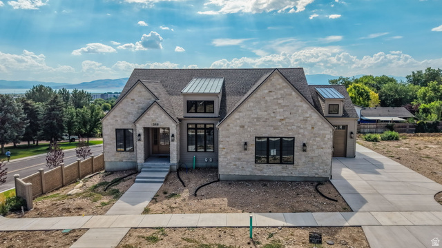 TO BE BUILT in Lake Ridge Farms, one of Orem's newest communities! Tucked away in a quiet cul-de-sac, this west-facing home is designed to take full advantage of the incredible lake views right from the front of your home. Imagine coming home each day to wide-open views and beautiful sunsets over the lake. Choose one of our thoughtfully designed floor plans, customize an existing plan, or create a fully custom home just for you. Enjoy an open, light-filled great room with soaring 10'+ ceilings, a fireplace, an upgraded chef's kitchen perfect for gathering and entertaining, a covered deck, and 9' basement ceilings. Many features that other builders consider upgrades are included as standard. Come experience Lake Ridge Farms and build a home designed around the views and the way you want to live!
